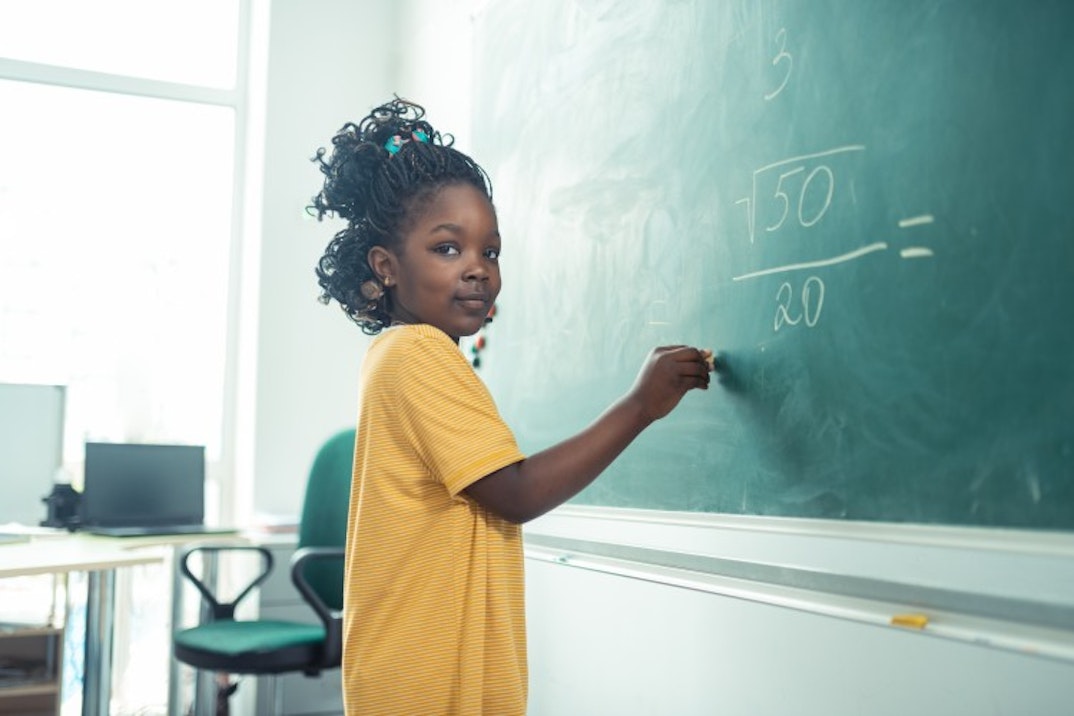 Girl writing on the board