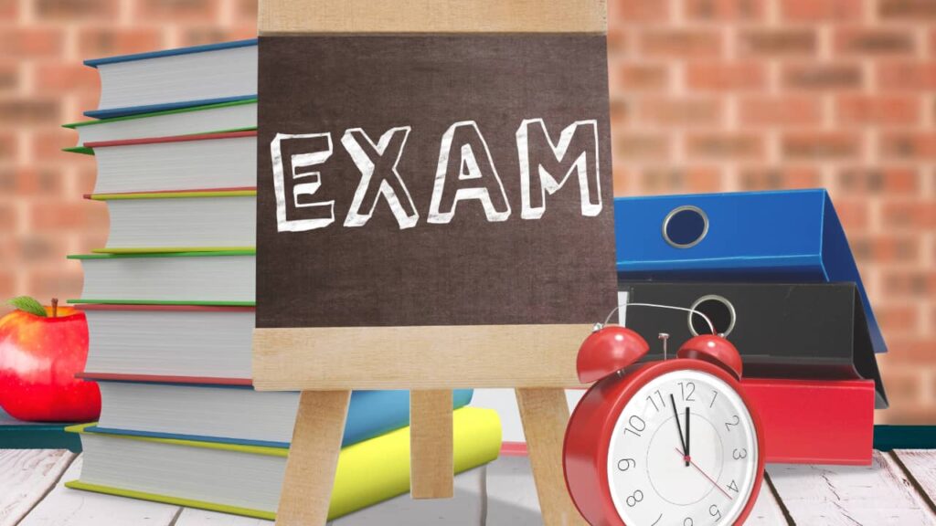 Exam text with alarm clock and files in background at MyGKGuru 