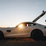 exotic car and the man in sunset