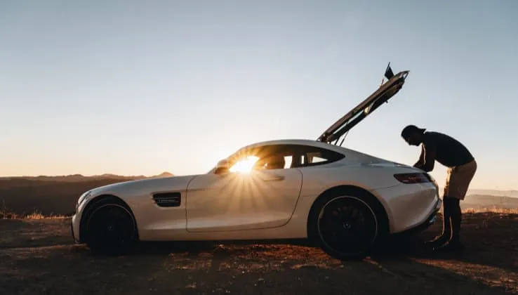 exotic car and the man in sunset